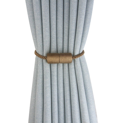 Black cylindrical magnetic curtain tieback holding a light blue pleated curtain, against a clean white background. - Image 6