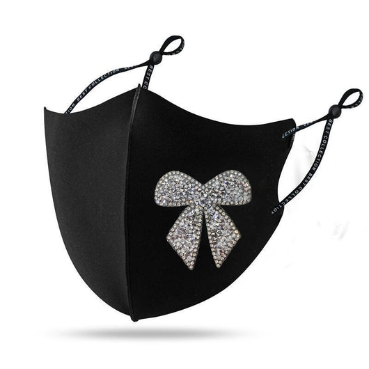 Black cloth face mask with a sparkling red and silver rhinestone bow design and adjustable ear loops. - Image 18