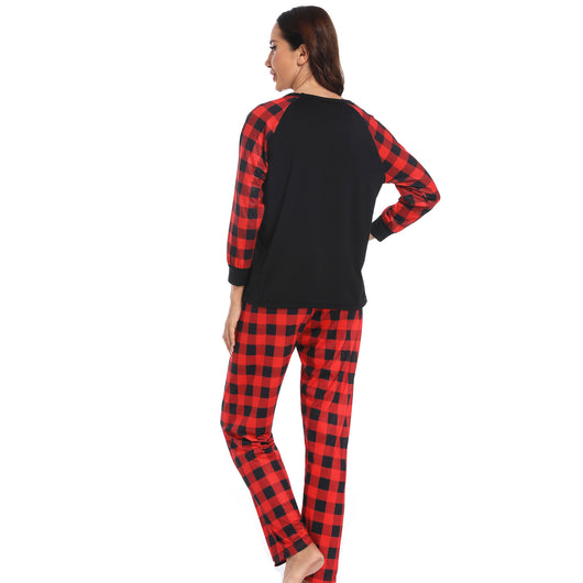 Kids' Christmas pajama set with a black "Christmas Crew" top and red and black buffalo plaid pants. - Image 5