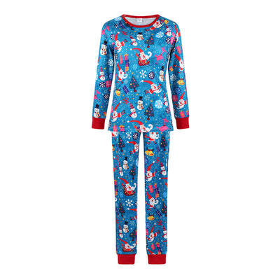 Family matching Christmas pajamas in blue with Santa, snowman, and tree print. Includes adult two-piece sets and a baby romper. - Image 4