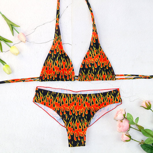 Flame print bikini swimsuit with a bandeau triangle top and tie-side split bottom in red, orange, yellow, and black. - Image 7