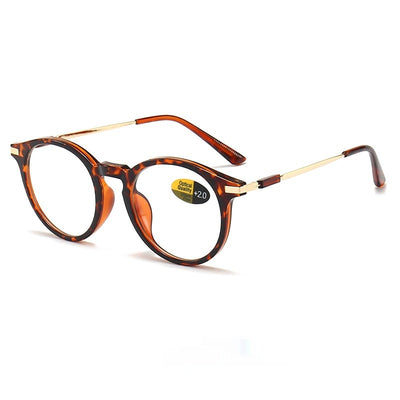 Dark purple round-frame anti-blue light reading glasses with silver-colored temples on a white background. - Image 3