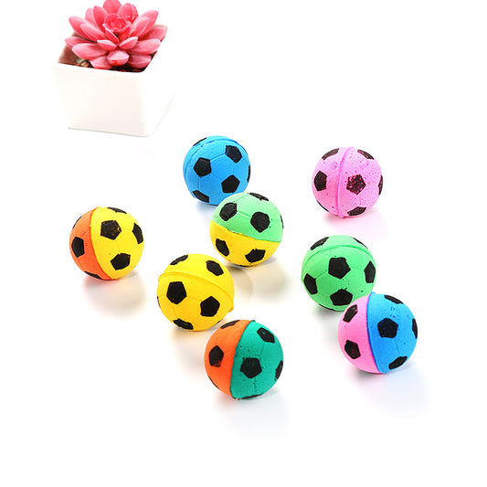 A set of colorful foam football-shaped cat toys in various two-tone combinations like yellow-orange, green-yellow, pink-blue, and pink-purple.