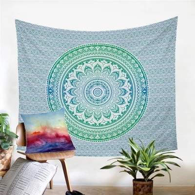 Blue and green ombre mandala tapestry with intricate geometric patterns, displayed as a wall hanging.