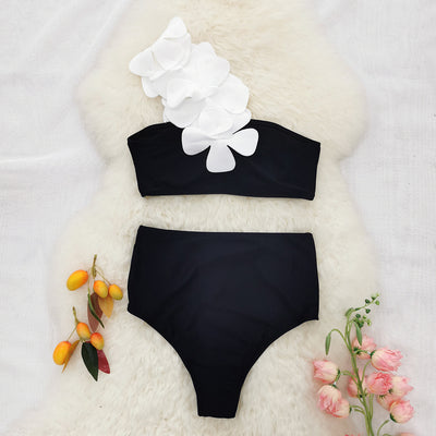 Women's black one-shoulder two-piece swimsuit with large white floral appliques and high-waisted bottoms. - Image 8