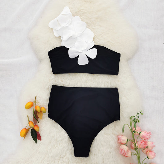 Women's black one-shoulder two-piece swimsuit with large white floral appliques and high-waisted bottoms. - Image 8