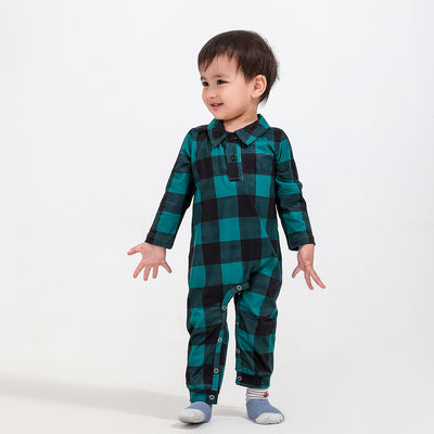 Family of four and dog wearing matching green and black plaid pajamas. Mother and father in two-piece sets, girl in dress, baby in two-piece, and dog in bandana - Image 6