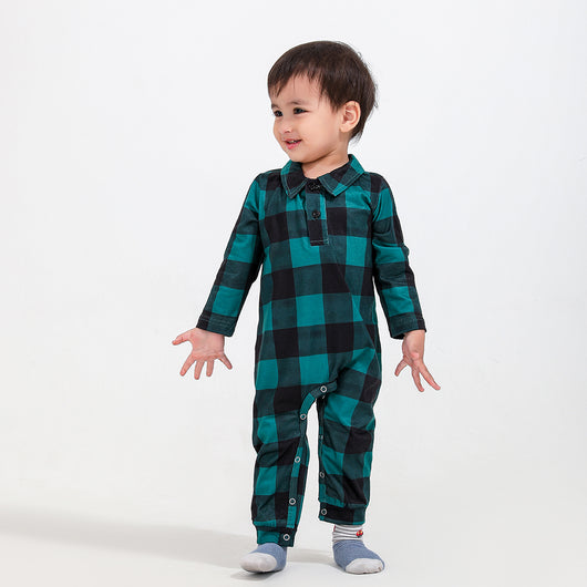 Family of four and dog wearing matching green and black plaid pajamas. Mother and father in two-piece sets, girl in dress, baby in two-piece, and dog in bandana - Image 6