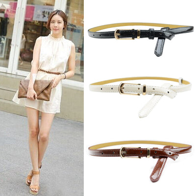 White patent leather women's belt with a slim strap and a gold-tone rectangular pin buckle. - Image 18