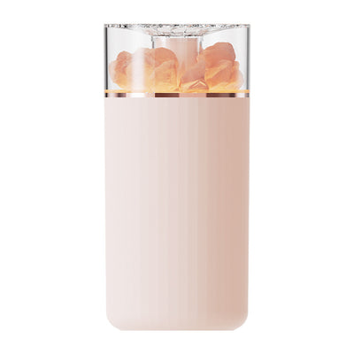 White portable aromatherapy humidifier with a clear top section displaying glowing pink salt crystals and a silver band. - Image 2