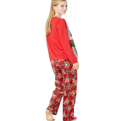 Family of five wearing matching Christmas pajamas with Rudolph the Red-Nosed Reindeer tops and red plaid pants. - Image 4