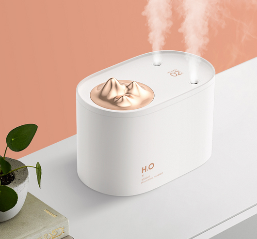 White portable humidifier with rose gold mountain-shaped mist outlet, 1000ml capacity, and compact design. - Image 2