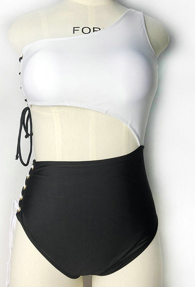 Black and white one-piece bikini with a one-shoulder white top and high-waisted black bottom, featuring lace-up sides. - Image 9