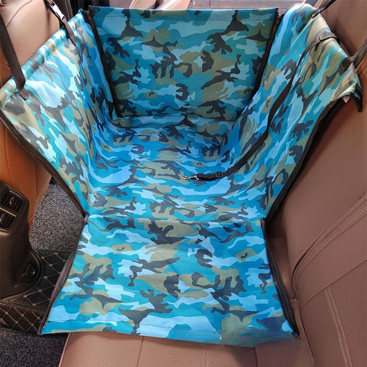 Brown pet car mat with colorful dog pattern installed in a car's rear seat, protecting upholstery. - Image 10