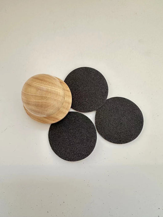 Red wooden dog claw grinding tool with a spherical handle and three circular black abrasive sanding pads. - Image 8