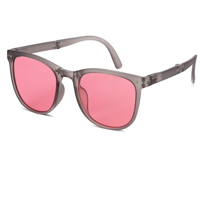 Beige oval-frame sunglasses with brown polarized lenses and foldable temples on a white background. - Image 14