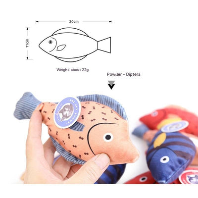 Orange fish-shaped plush catnip toy with blue fins and tail, held in a hand, with a small round tag. - Image 2