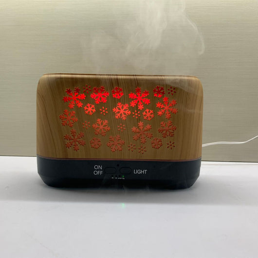 Wood grain humidifier with snowflake pattern, emitting blue flame-like mist, shown with remote control and other color options. - Image 11