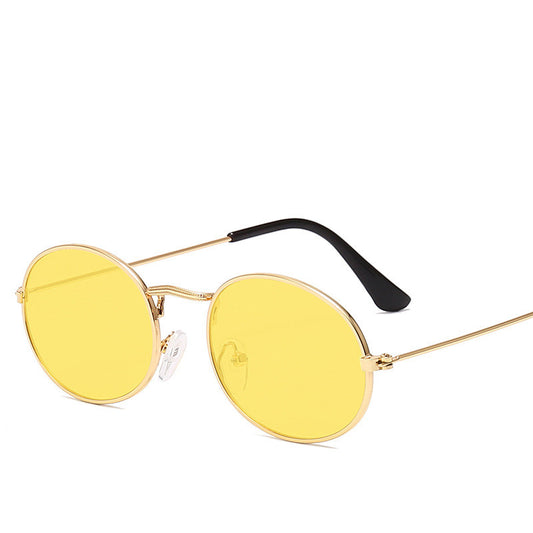 Retro round frame sunglasses with gold metal frames, black lenses, and black temple tips on a white background.