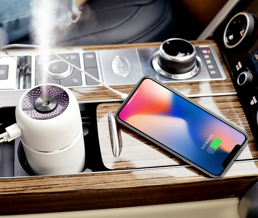 Black portable humidifier with a silver band, a power button, and a water level indicator, suitable for car or home. - Image 12