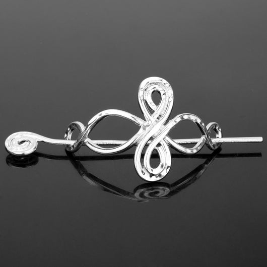 Silver metal hair clip with a retro dragon head and infinity knot design, secured by a plug-in hairpin. - Image 3