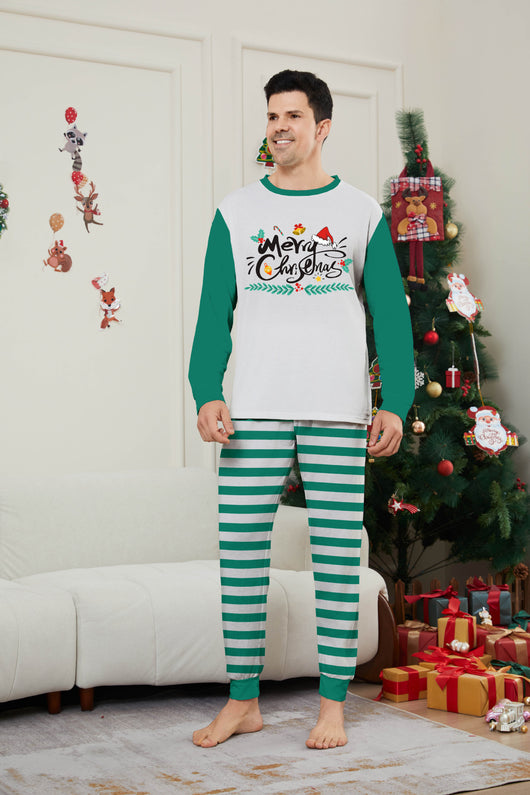 Family of four wearing matching green and white striped Christmas pajamas with "Merry Christmas" graphic. - Image 15