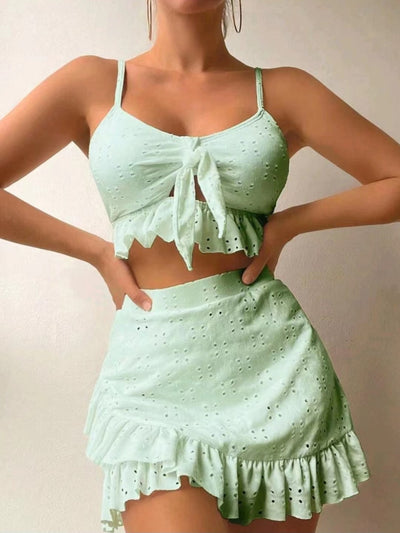 Light blue eyelet two-piece swimsuit set with a tie-front crop top and a matching ruffle-trim hip-hugging skirt. - Image 9