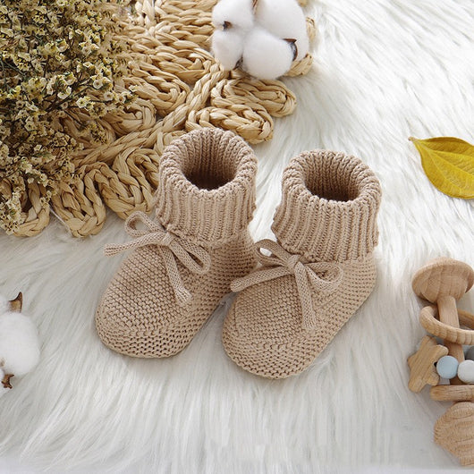 Pink knitted infant toddler shoes with cute bowknots and elastic bands, displayed on a soft white rug. - Image 10
