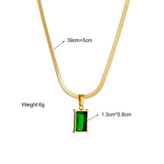Gold hoop earrings with rectangular emerald green zircon pendants, displayed on a light beige fabric. - Image 13