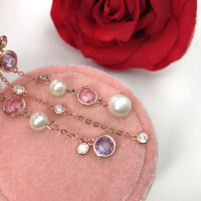 Aretes Estrella de Ocho Puntas Dorados con Diamantes y Borla de Perla - Image 2