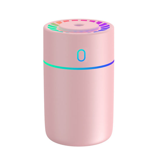 Pink cylindrical humidifier with a colorful LED light ring on top and a blue-green light band around its middle. - Image 5