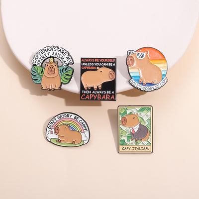 Cute capybara enamel brooch wearing a pink donut with sprinkles and "DONUT WORRY BE CAPPY" text. - Image 3