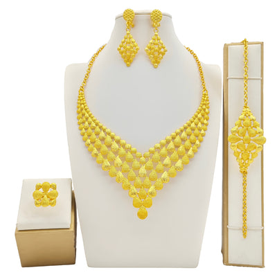 Women's four-piece gold-tone jewelry set with floral designs, including a necklace, bracelet, ring, and earrings. - Image 3