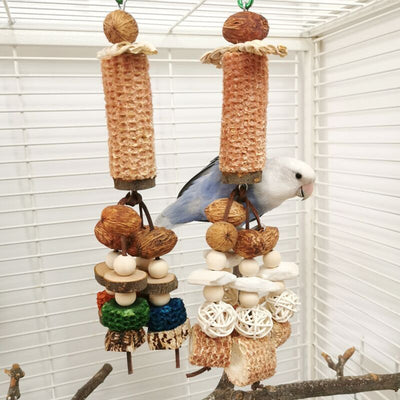 Hanging parrot chew toy made from natural wood slices, corncob, vine balls, and colorful textured blocks. - Image 4