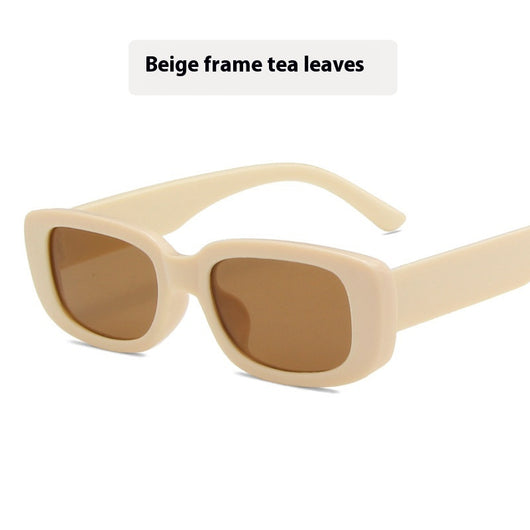 Children's small frame oval sunglasses with a solid white PC frame and brown AC lenses for UV protection. - Image 13