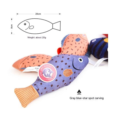Orange fish-shaped plush catnip toy with blue fins and tail, held in a hand, with a small round tag. - Image 16