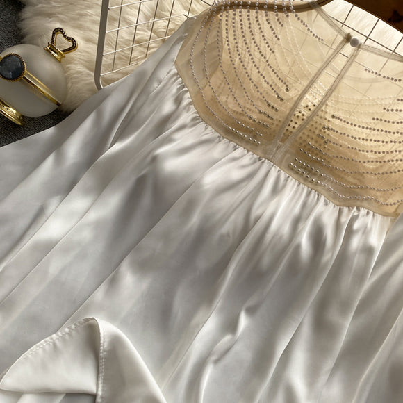 Blusa Elegante Plisada con Malla Transparente y Detalles Perlados