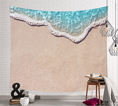 Beach tapestry with a realistic print of sand and ocean waves, suitable for wall hanging or as a beach towel.