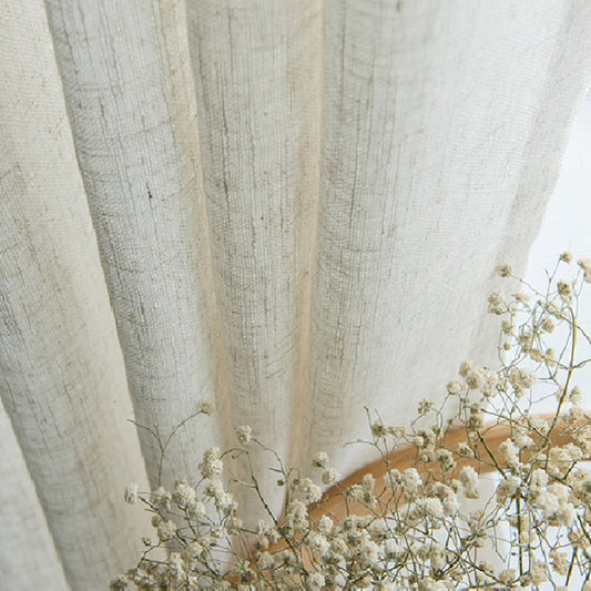 Close-up of a natural linen half-shade curtain with a textured weave and soft folds, paired with dried baby's breath flowers. - Image 2