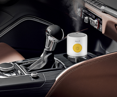 White and clear mini USB ultrasonic mist aroma essential oil diffuser with a yellow power button and gray top. - Image 6
