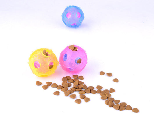 Three translucent hollow toy balls in pink, blue, and yellow, with textured surfaces and internal components. - Image 2