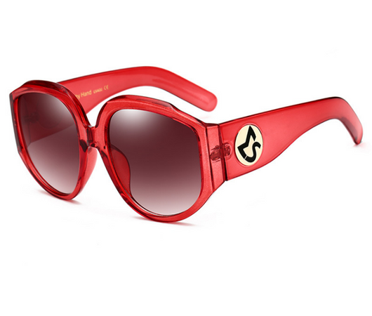Oversize round sunglasses for women with olive frames, dark gradient lenses, and a gold emblem on the temples. - Image 12