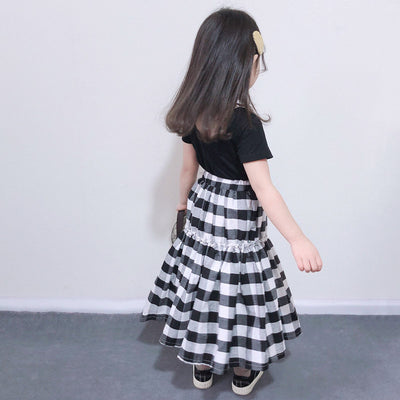 Matching black and white gingham two-piece outfits, one adult and one child size, with black short-sleeve tops and tiered skirts. - Image 13