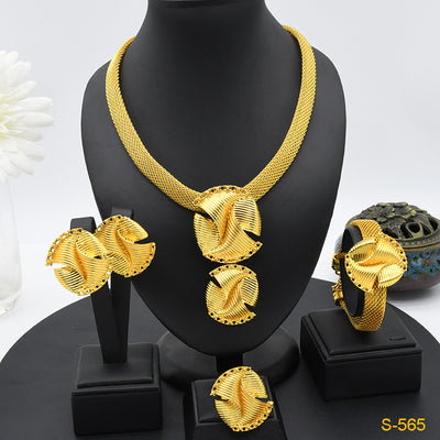 Gold-colored four-piece jewelry set with mesh texture: necklace, drop earrings, bracelet, and ring, all with knot design. - Image 10