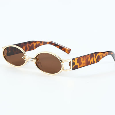 Retro small frame sunglasses with gold round frames and leopard print temples, held by a hand. - Image 3