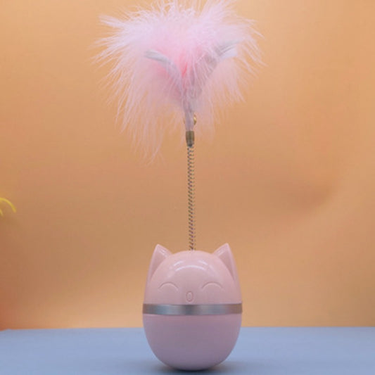 Pink cat-shaped tumbler toy with a feather attachment, featuring a cute face and silver band.