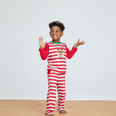 Young boy wearing a red and white striped long-sleeved pajama set with a reindeer graphic on the chest. - Image 12