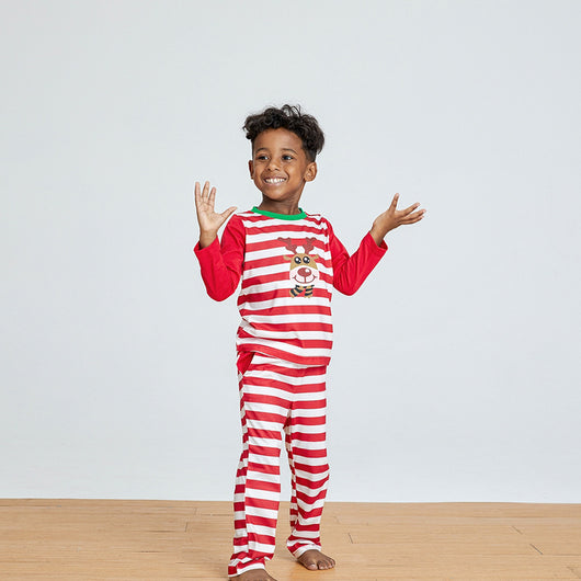 Young boy wearing a red and white striped long-sleeved pajama set with a reindeer graphic on the chest. - Image 12
