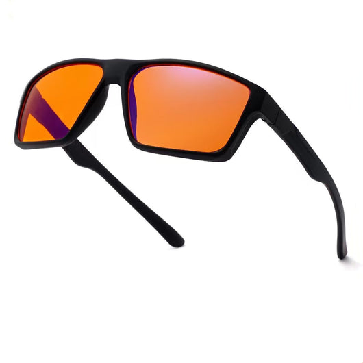 Black frame blue light blocking glasses with orange lenses and 're sleep' logo on the temple.