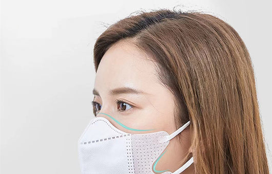 Peach disposable 3-layer face mask with perforated details worn by a person, offering comfortable daily protection. - Image 28